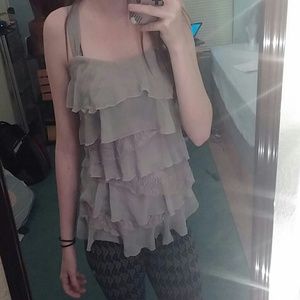 A grey lace ruffled tank top.