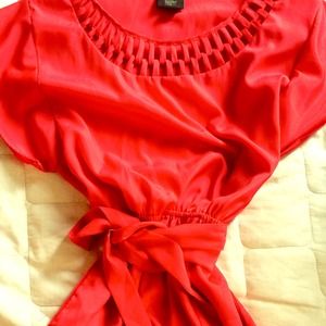 Coral pink, short sleeve dress with tie at waist.
