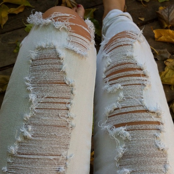 Distressed white jeans