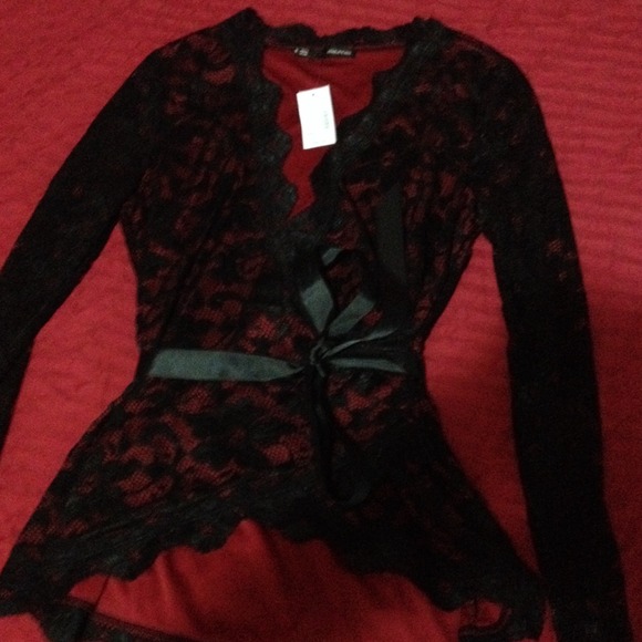 Black lace wrap top with red accent