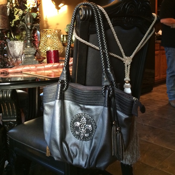 Pewter Fleur De Lis leather like shoulder purse.