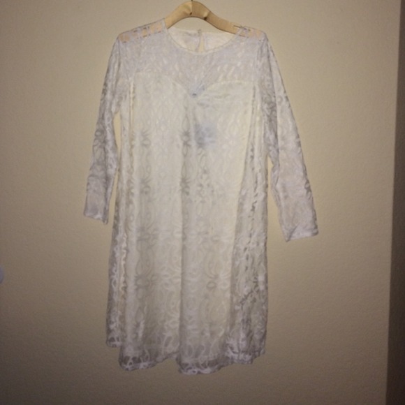 Cream dress with lace overlay.