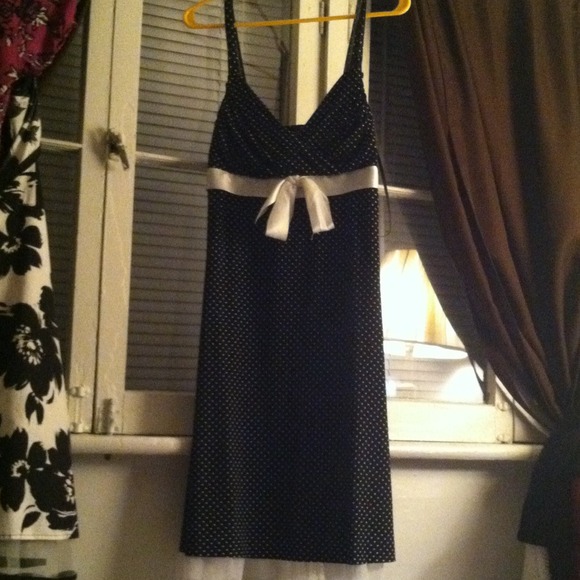 A little black dress with white polka dots