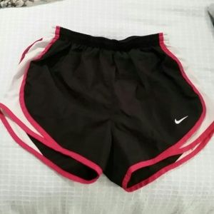 Red, white and black Nike running shorts