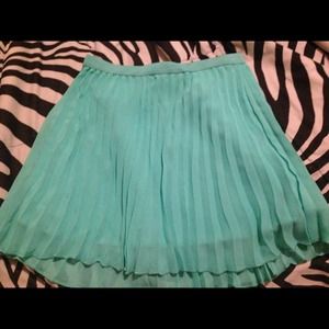 Turquoise skirt.