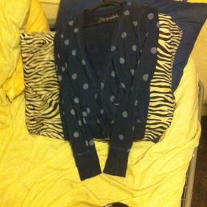A navy blue with light blue polka dot cardigan