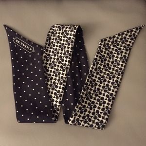 Like new, gently used Coach silk pony tail scarf.