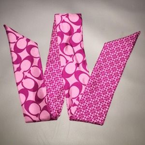 Like new, gently used Coach silk pony tail scarf.