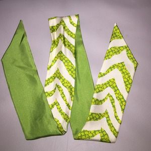 Like new, gently used Coach silk pony tail scarf.