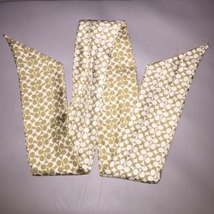 Like new, gently used Coach silk pony tail scarf.