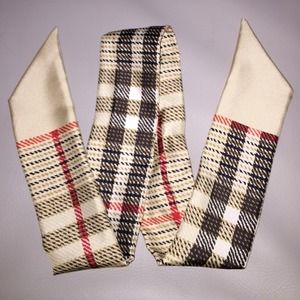 Like new, gently used Burberry silk scarf.