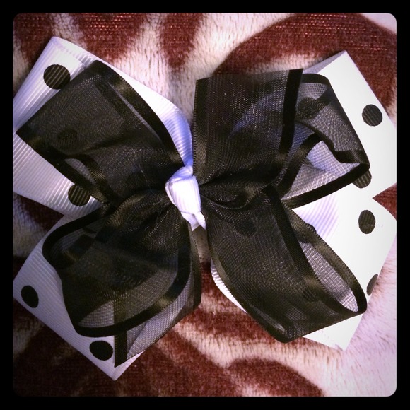 White and black polka dot bow