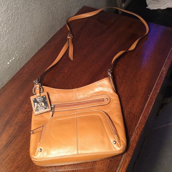 Brown leather Tignanello cross body. Never used.