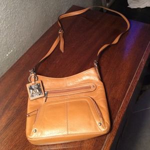 Brown leather Tignanello cross body. Never used.