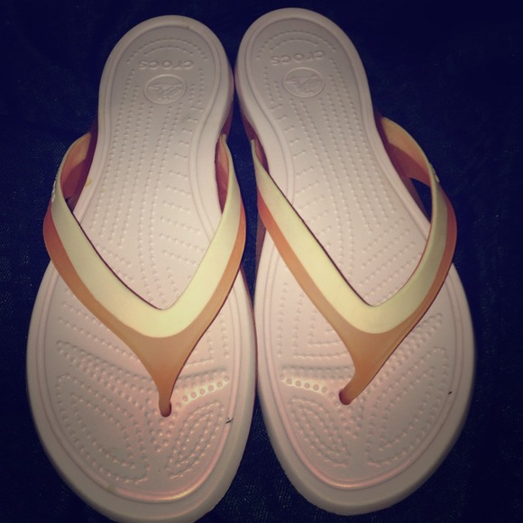 Pink croc flip flops size 10