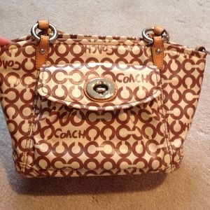 Brown and cream coach purse