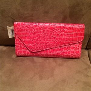 Never worn coral clutch