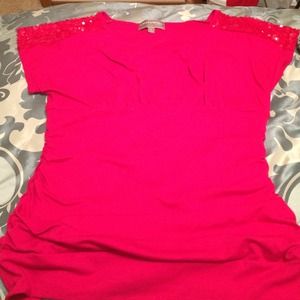 Dark pink shirt with sequined shoulders.