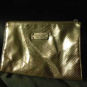 Golden Michael Kors makeup bag or clutch