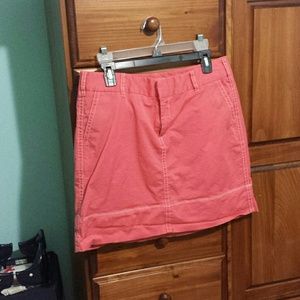 Coral skirt with white stitching