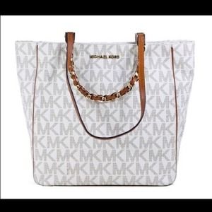 Michael kors creme colored bag with gold accents