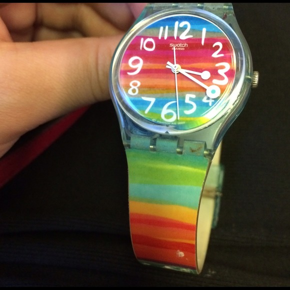 Swatch watch with striped rainbow face and strap