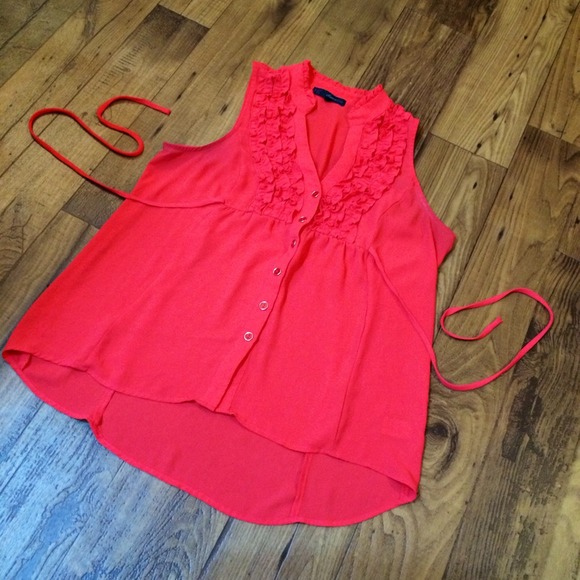 Coral sleeveless top with ruffled neckline