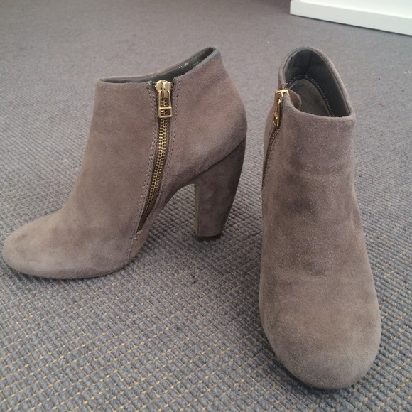 Steve Madden boots with gold zipper.