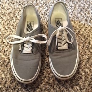 grey vans with black lace holes