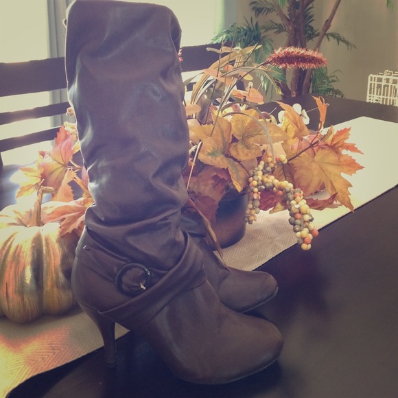 High brown boots with a heel