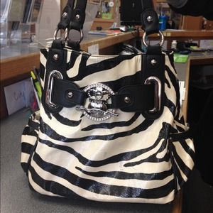 Kathy Van Zeeland zebra print handbag.
