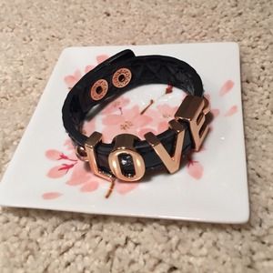 BCBG black bracelet with "LOVE" lettering