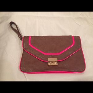 Aldo tan clutch with neon pink trim.