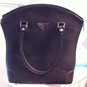 Black real leather handbag. NWT.