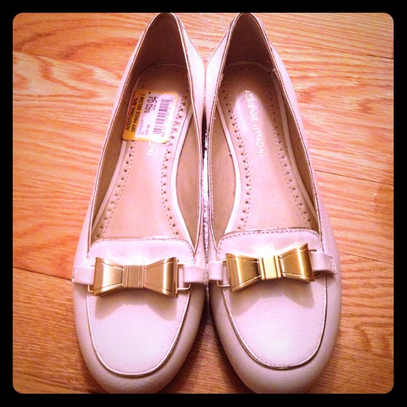 White Adrienne Vittadini flats with gold bows