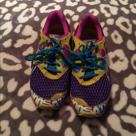 Gently used glow in the dark asic running shoes.