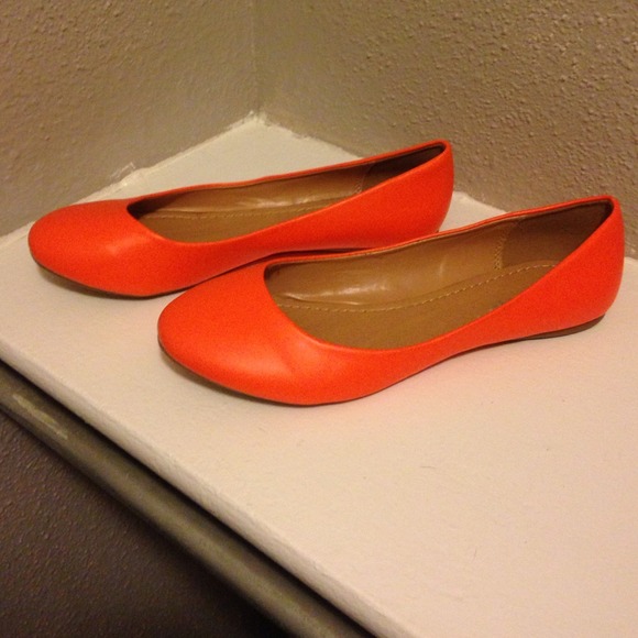 Bright orange flats