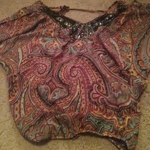 Nice dressy loose shirt. Never worn.