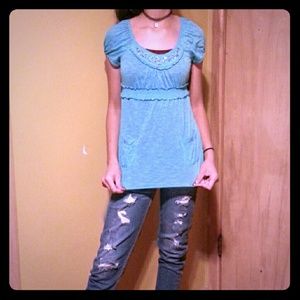 A sparkly blue blouse