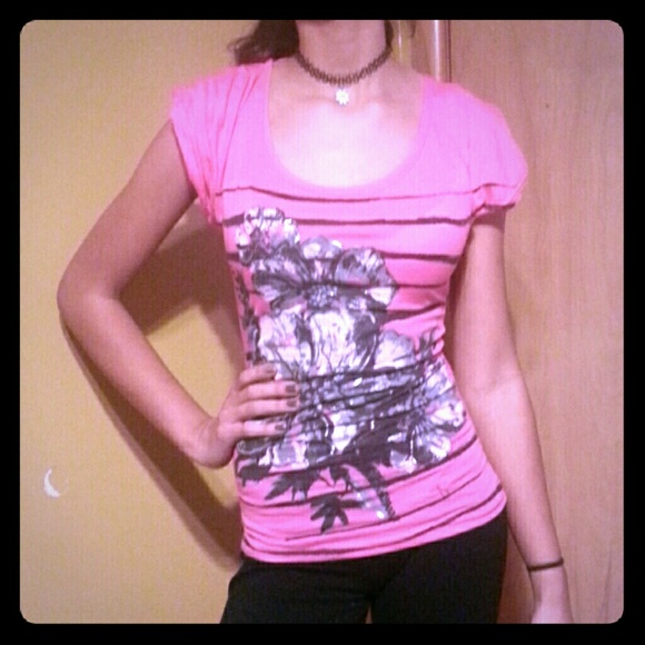 Pink bold blouse with black flower print.