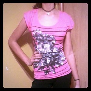 Pink bold blouse with black flower print.