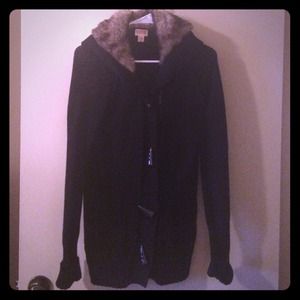 Long black sweater with faux fur on hood.