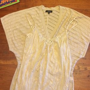 Gold shimmer shirt with gold tank top.