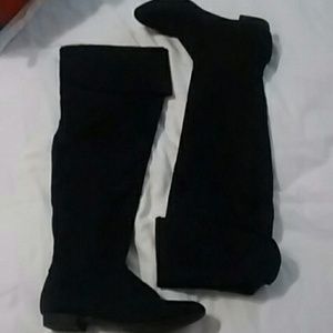 Tall black suede like boots.