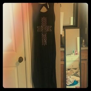 Black High-low Dress with a gold accent cross.