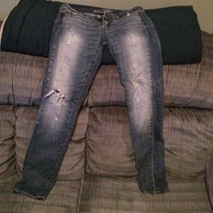 Light wash destroyed skinny AE jeans