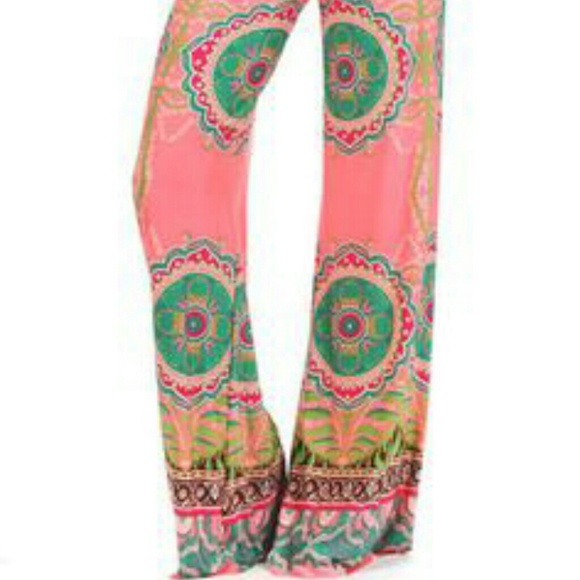 Bright coral palazzo pants.