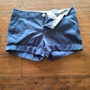 Navy blue shorts.