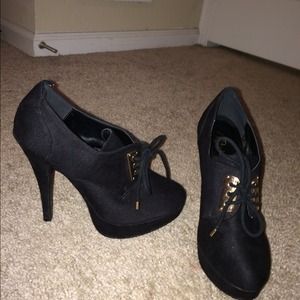 Black and gold bootie heels.