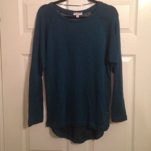 dark turquoise. oversize sweater. slightly sheer.